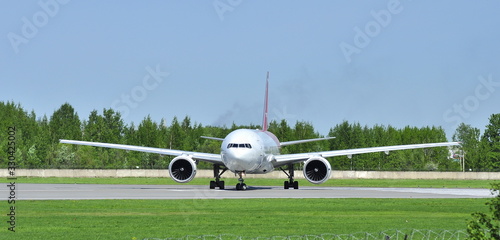 The plane is on the runway. Boeing 777