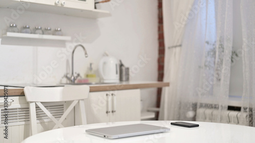 Young Woman Coming and Sitting to Use Laptop