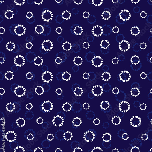 Vector blue shibori simple circle polkadot seamless pattern. Suitable for textile, gift wrap and wallpaper.