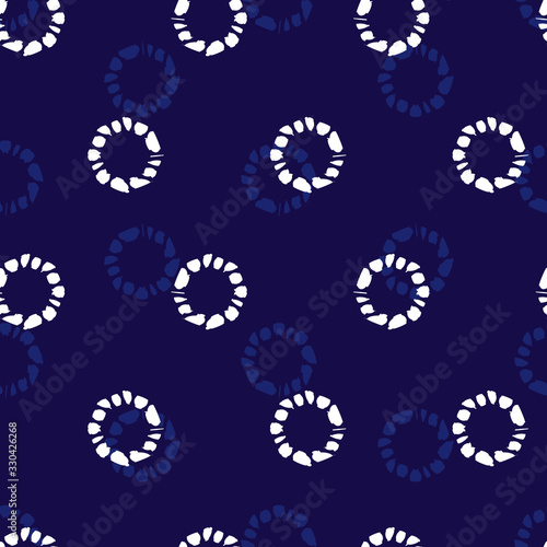 Vector blue shibori circle seamless pattern. Suitable for textile, gift wrap and wallpaper.