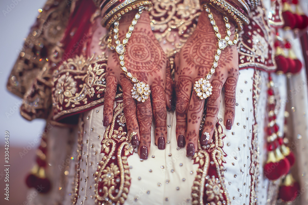 Indian hindu bride's wearing her wedding jewellery close up