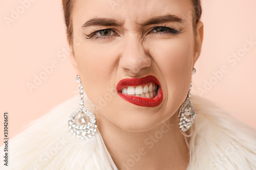 Emotional young woman on co...