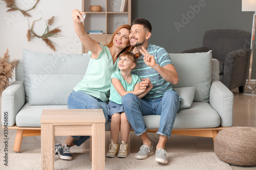 Family taking selfie at home