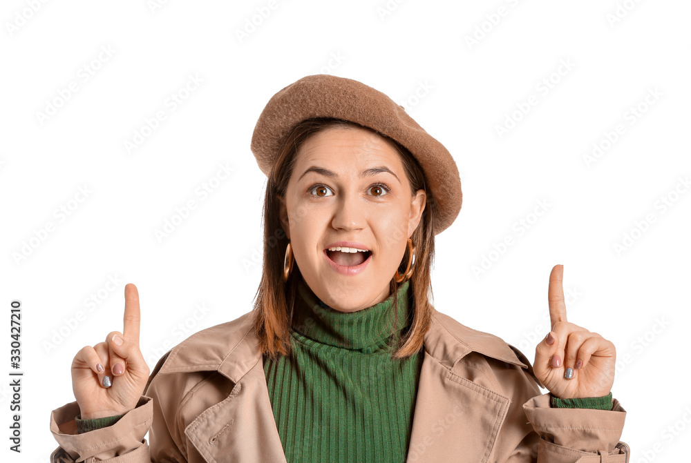 Stylish young woman showing something on white background Stylish young woman showing something on white background