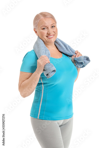 Sporty mature woman on whit...