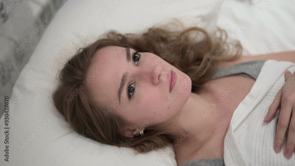 Pensive Beautiful Young Woman Thinking in Bed Pensive Beautiful Young Woman Thinking in Bed