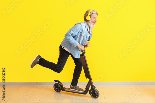 Happy elderly man with kick...