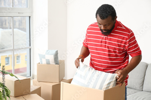 African-American man unpack...
