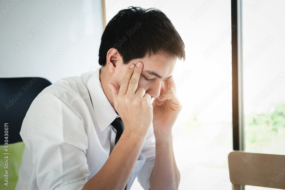 male employees show headaches from work or disappointment from work. Health and care concept male employees show headaches from work or disappointment from work. Health and care concept