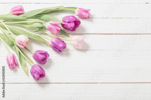Fototapeta Naklejka Na Ścianę i Meble -  beautiful  tulips on white wooden background