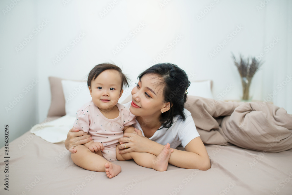 Beatuful mother playing with daughter. Little girl have fun at home. Beatuful mother playing with daughter. Little girl have fun at home.