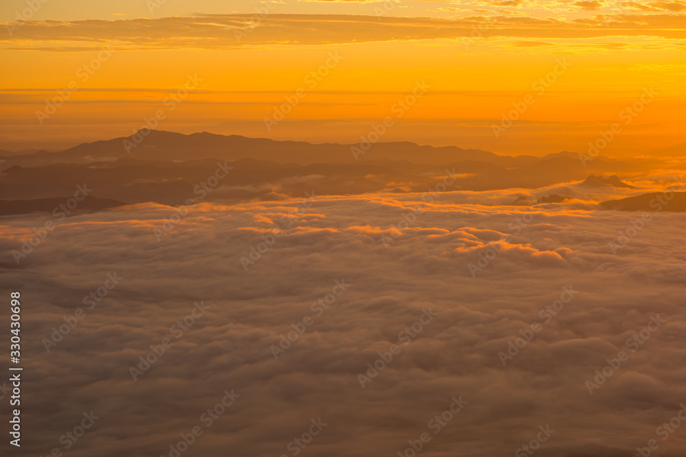 Mountain top view of sunrise landscape in the rainforest, Thailand.