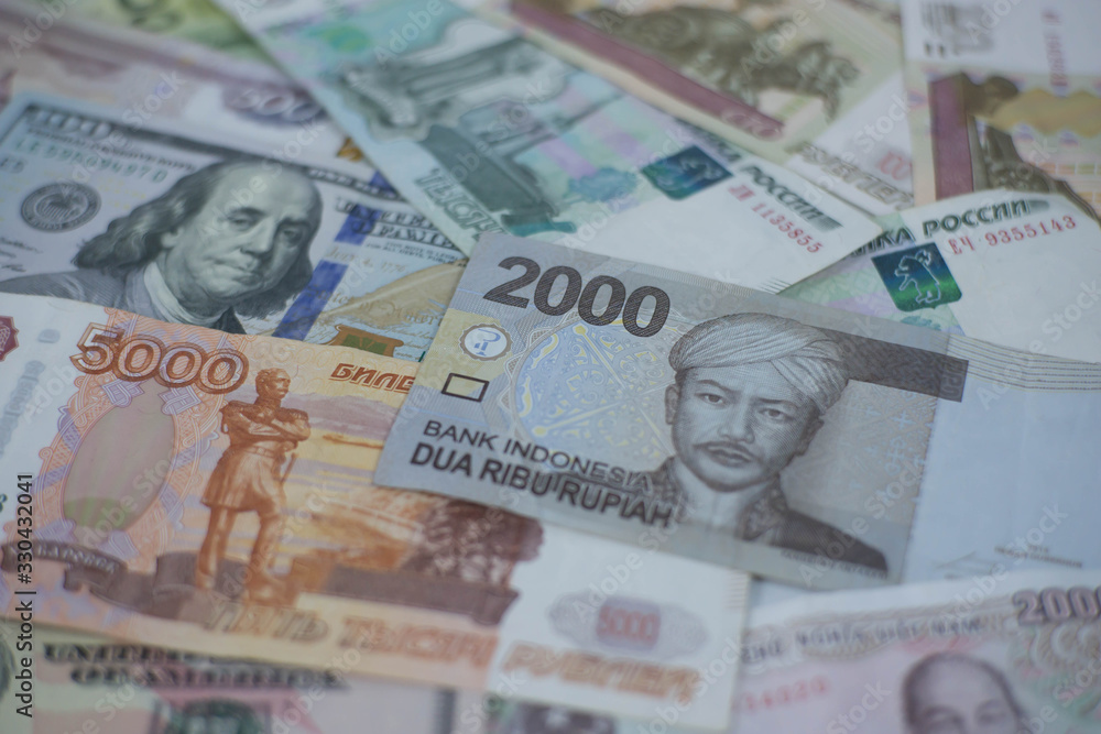 A collection of international currencies. Dollar bill, Bank note. Money Exchange Finance Business concept.
A collection of international currencies. Dollar bill, Bank note. Money Exchange Finance Business concept.