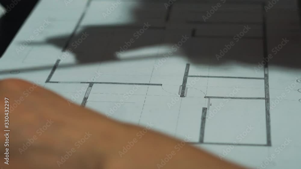 Close Up of Female Drawing Floor Plans Close Up of Female Drawing Floor Plans