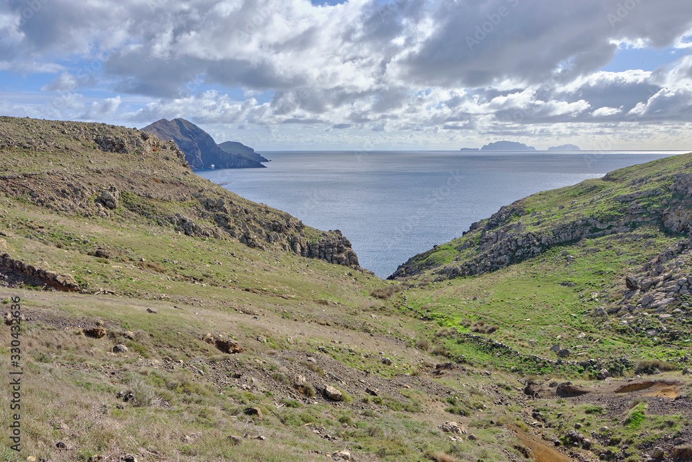 Scenic view of mountain and hills of Point of Saint Lawrence (Ponta de São Lourenço) - the easternmost point of the island of Madeira. Cloudy look of landscape of tropical island in Atlantic ocean