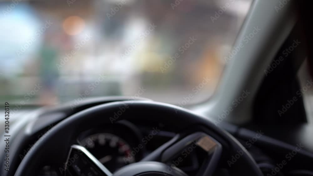 man driving car in day time, hand on steering wheel, shallow depth of field man driving car in day time, hand on steering wheel, shallow depth of field
