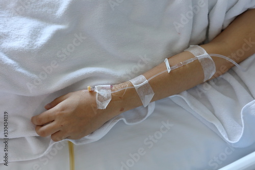 iv infusion intravenous injection of patient illness lying on bed