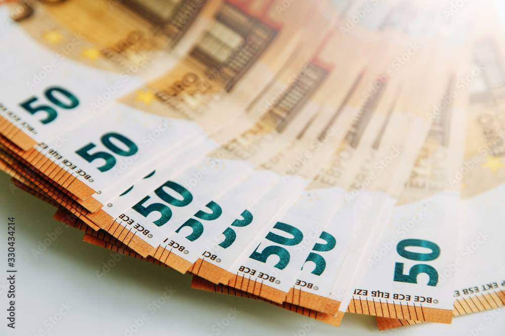 Obraz premium Layout of money on a white background Flatley. Paper money account in Europe. 50 Euro banknotes.