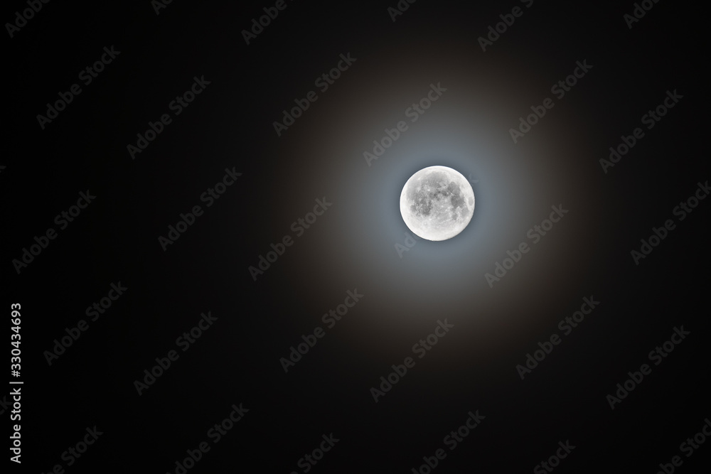 The spring full moon on a foggy morning The spring full moon on a foggy morning