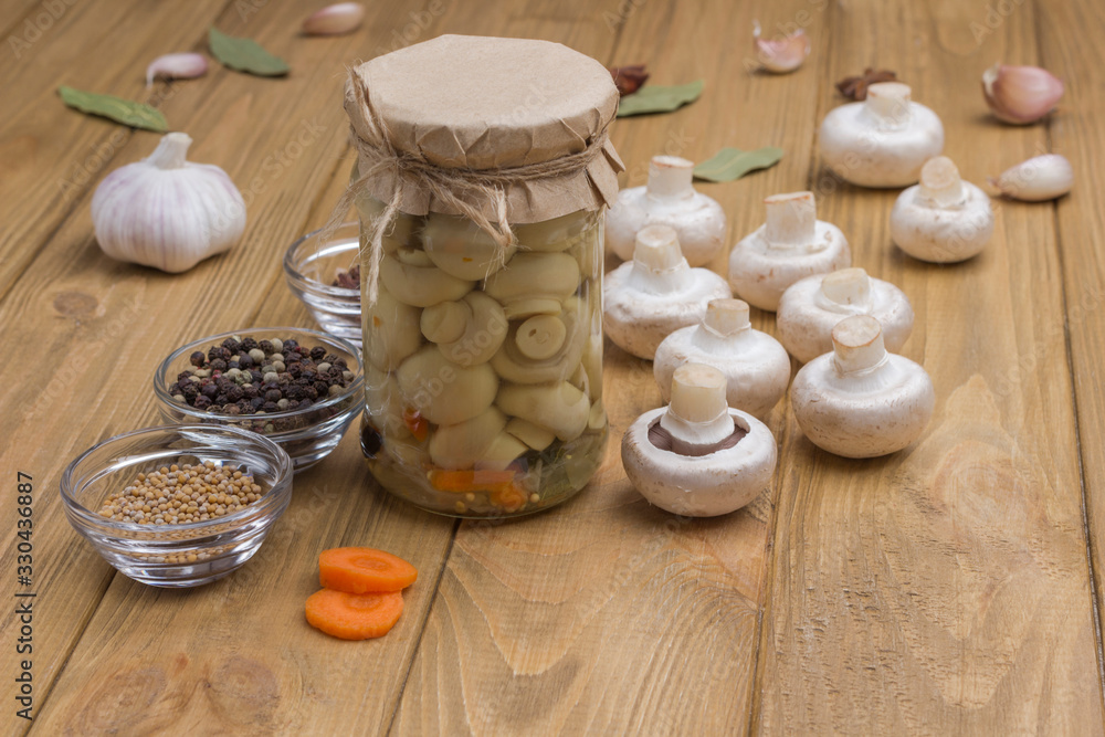 Fermentation Products. Glass jar with canned mushrooms.
