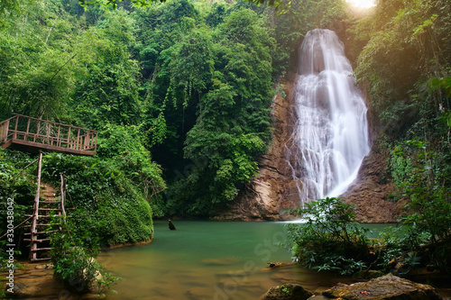 waterfall clear water and green emerald for nature holiday relax and summer vacation travel with tree and stone or rock in forest at nang khruan waterfall 3rd floor in lam khong ngu national park