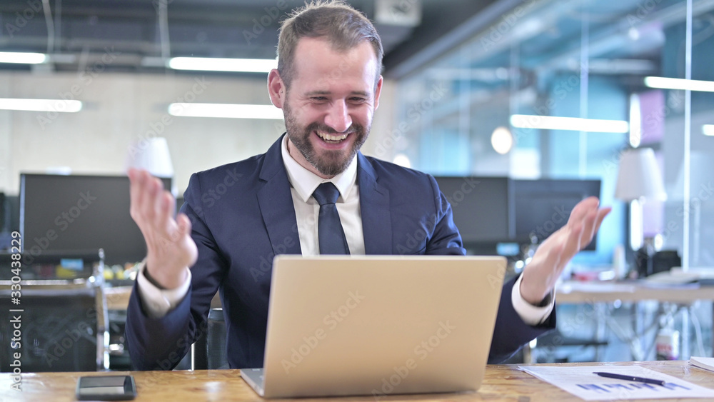 The Surprised Young Businessman celebrating with both Fist The Surprised Young Businessman celebrating with both Fist