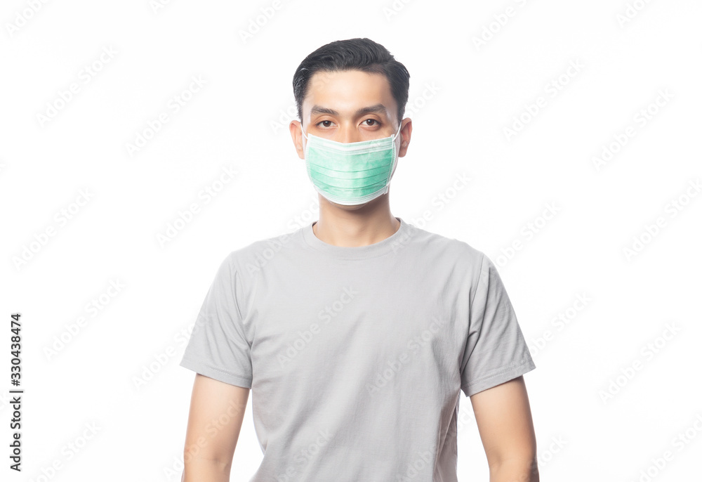 Young Asian Man wearing hygienic mask to prevent infection, 2019-nCoV or coronavirus. Airborne respiratory illness such as pm 2.5 fighting and flu. Studio shot isolated on white background. Young Asian Man wearing hygienic mask to prevent infection, 2019-nCoV or coronavirus. Airborne respiratory illness such as pm 2.5 fighting and flu. Studio shot isolated on white background.