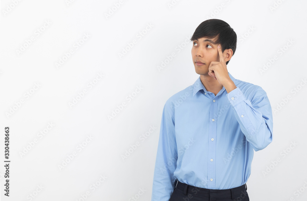 Young handsome asian business man thinking an idea while looking up isolated on white background. Young handsome asian business man thinking an idea while looking up isolated on white background.