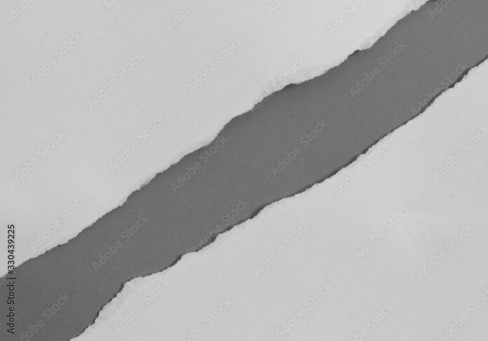 torn paper on gray background with copy space for text torn paper on gray background with copy space for text