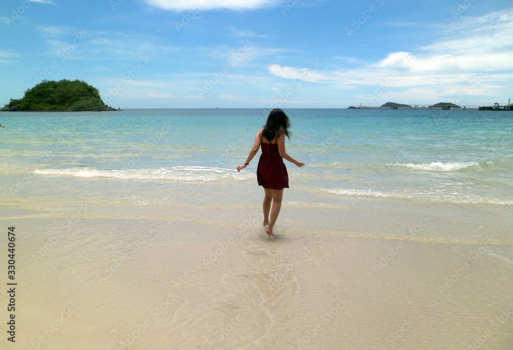 Rayong, Thailand - 15th September 2014 : Asian Girl on Sai Kaew Beach along Coastline in Sattahip, Rayong, Thailand