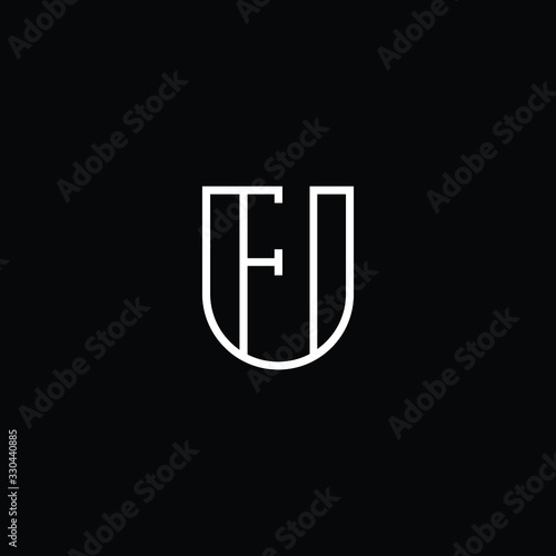  Minimal elegant monogram art logo. Outstanding professional trendy awesome artistic FU UF initial based Alphabet icon logo. Premium Business logo White color on black background