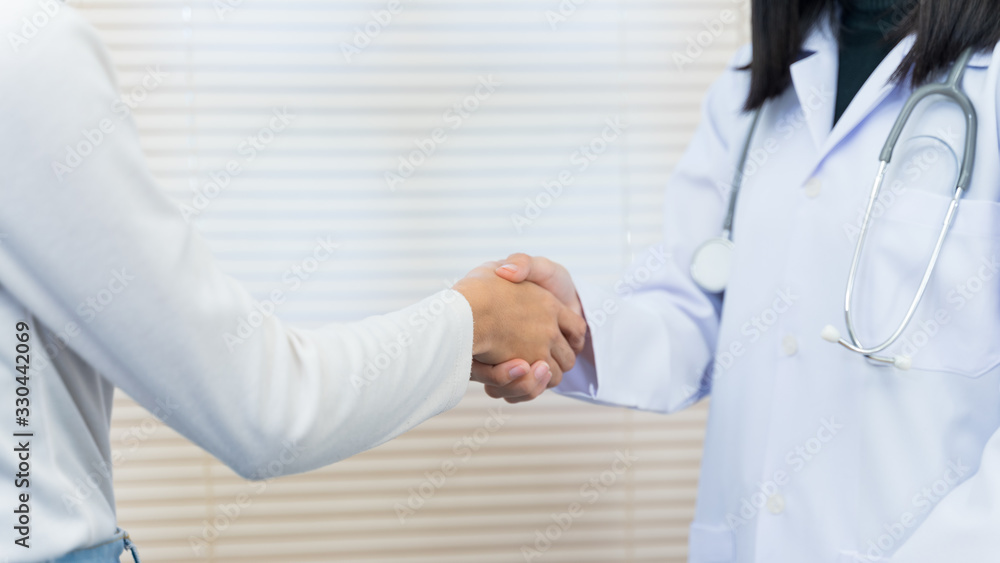 Close up of a doctor expressing his congratulations to the patient for illness recovery and before checking hospital. Doctor is congratulations the patient. Close up of a doctor expressing his congratulations to the patient for illness recovery and before checking hospital. Doctor is congratulations the patient.