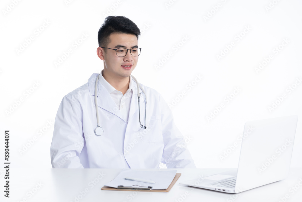 A young Asian doctor is using a device A young Asian doctor is using a device
