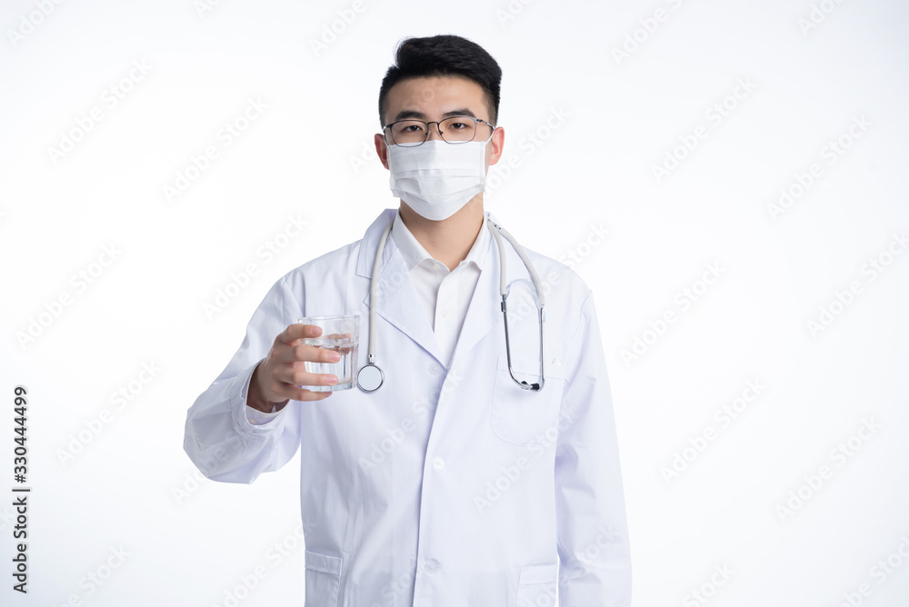 A young Asian doctor is using a device A young Asian doctor is using a device