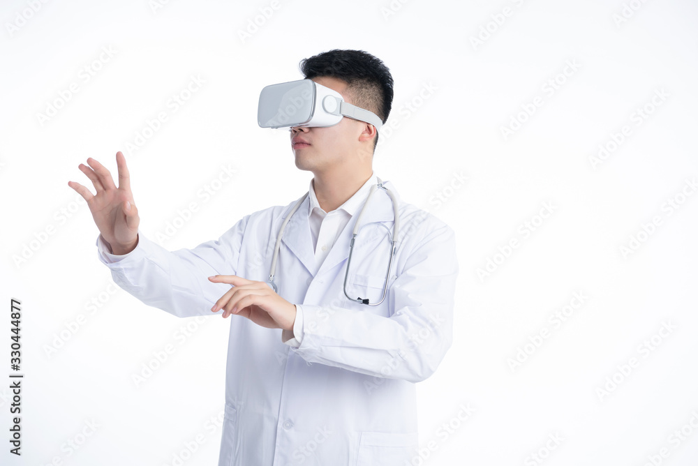 A young Asian doctor is using a device A young Asian doctor is using a device