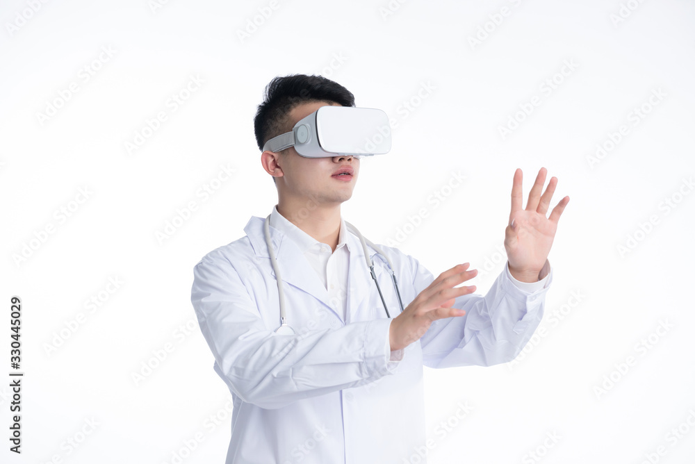 A young Asian doctor is using a device A young Asian doctor is using a device