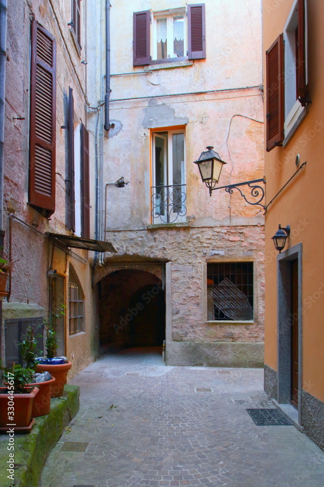 NARROW STREET IN ARGEGNO VILLAGE IN ITALY
