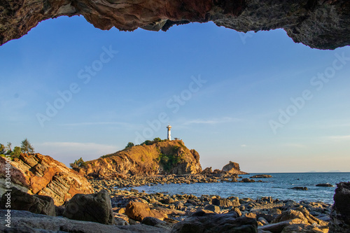 The rocky beach in Ko Lanta National Park. In the evening, the team saw the lighthouse with clear sky.