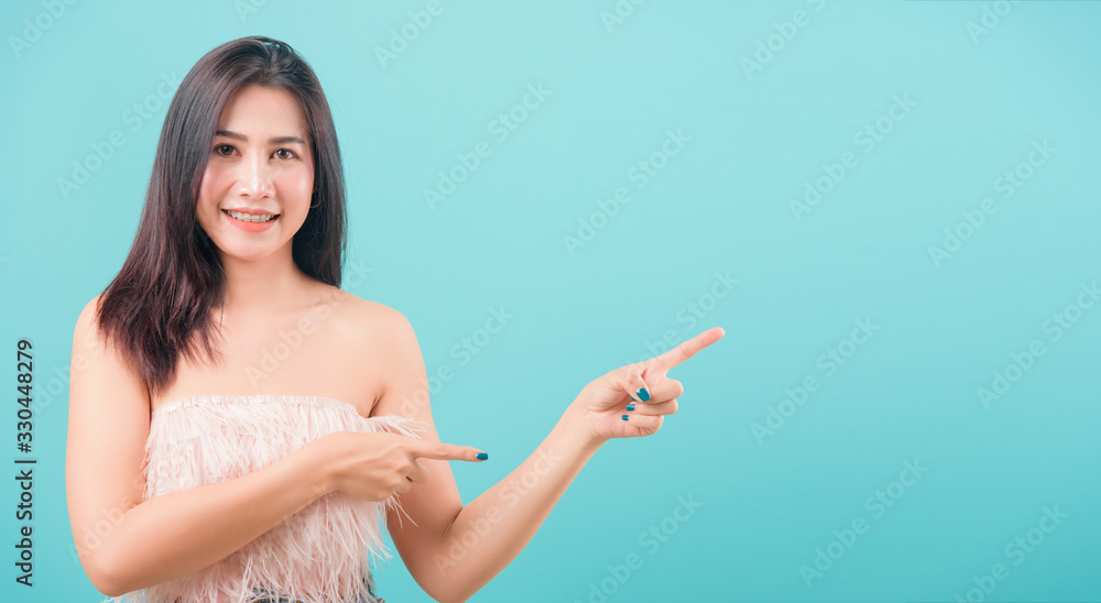 woman standing her popointing finger outside woman standing her popointing finger outside