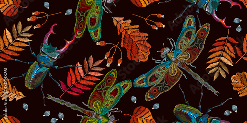 Embroidery. Dragonflies, autumn leaves and beetle deer, seamless pattern. Template for clothes. Fashion design. Insects art
