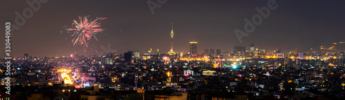 Beautiful and colorful skyline of Tehran city the capital of Iran with amazing fire works in the sky.