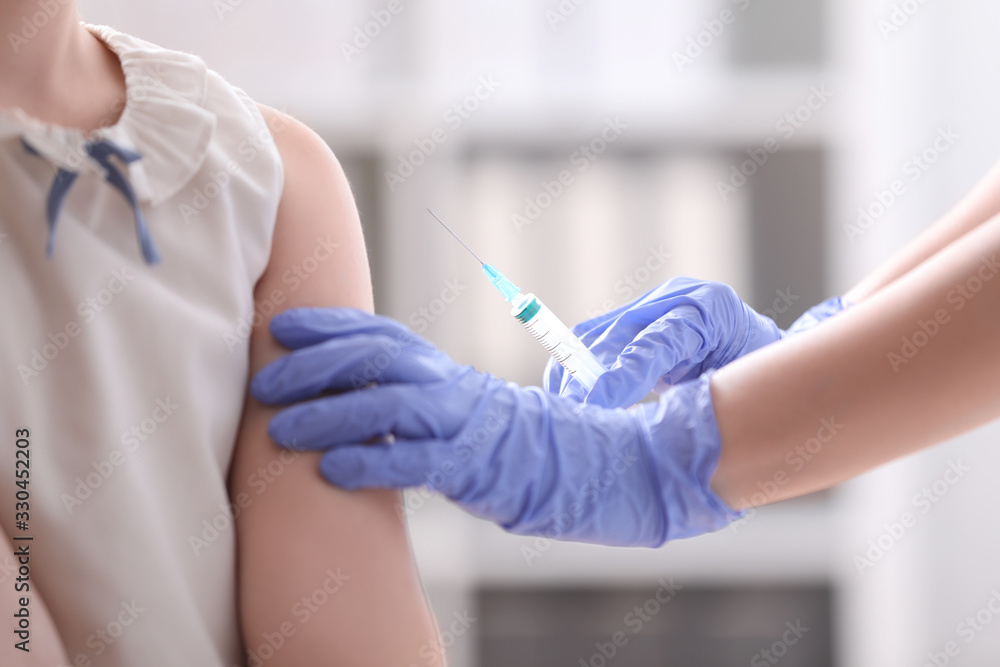 Little girl receiving chickenpox vaccination in clinic. Varicella virus prevention Little girl receiving chickenpox vaccination in clinic. Varicella virus prevention