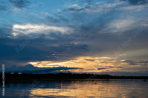 Amazon river sunrise © Robin E.