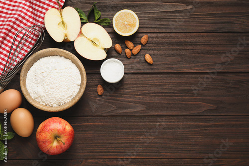 Flat lay composition with fresh products on wooden table  space for text. Healthy cooking