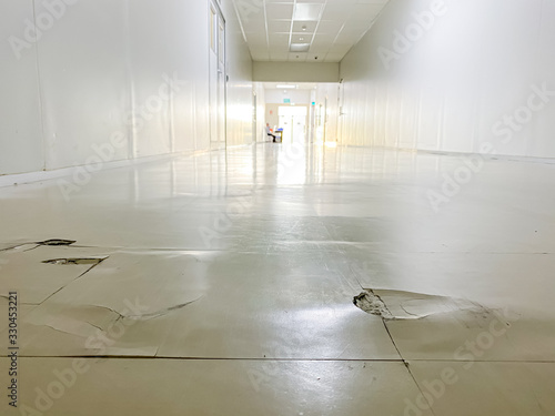 cracked floor in factory,dilapidated building,broken corridor 