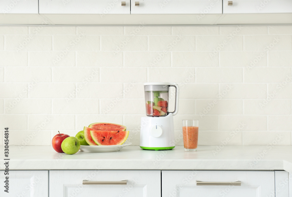 Blender and smoothie ingredients on counter in kitchen Blender and smoothie ingredients on counter in kitchen