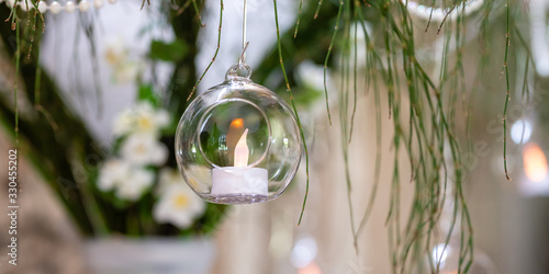 Decorative candle in a glass bubble