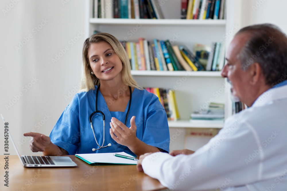 Pretty blond medical scientist, talking with doctor Pretty blond medical scientist, talking with doctor