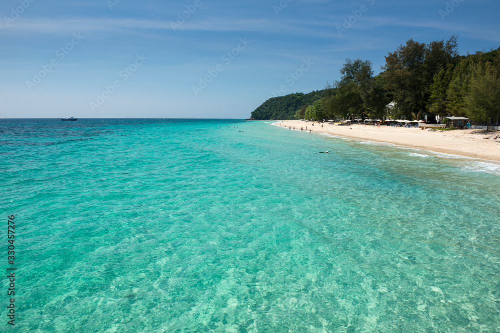 Naklejka premium Sea view from tropical beach with sunny sky. Summer paradise beach of phuket island. Tropical shore. Tropical sea in phuket. Ocean beach relax, outdoor travel.Phuket,Thailand