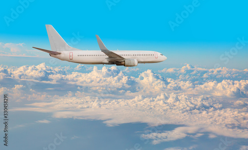 Commerical passenger airplane in the clouds. travel by air transport 
